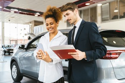 A woman buying a car