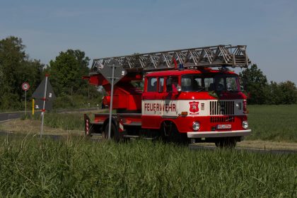 a red fire truck parked on the side of the road