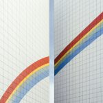 a couple of white walls with a rainbow painted on them