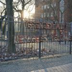 a fence that has a sign on it