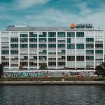 white concrete building near body of water