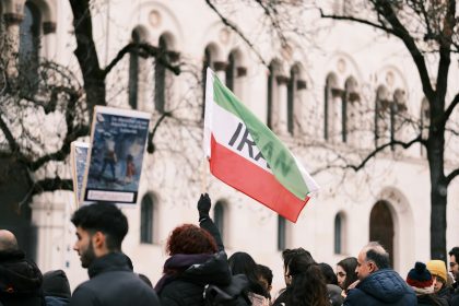 a crowd of people standing in front of a building