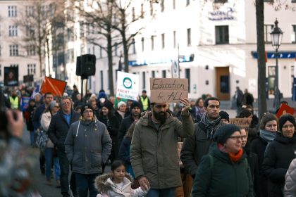 a large group of people walking down a street