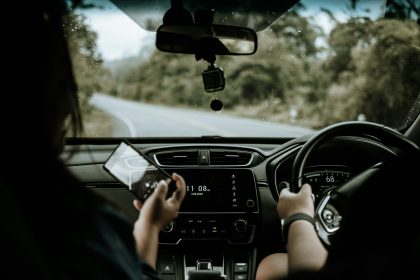 person driving car during daytime