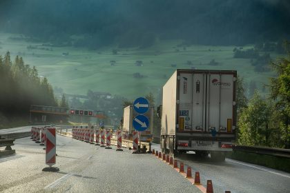 white and blue truck on road during daytime