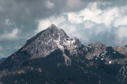 white and brown mountain under white clouds during daytime