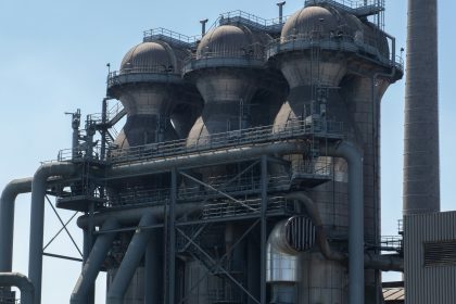 a large industrial building with a lot of pipes