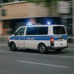 a police van driving down a city street