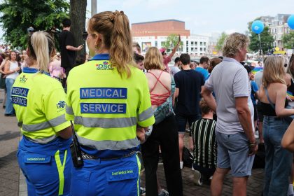 A group of people standing around each other