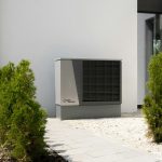 a air conditioner sitting on the side of a building