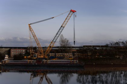 A crane that is sitting in the water