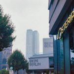 a view of a street with a building in the background