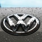 water dew on silver Volkswagen car emblem