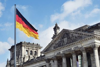 The German flag flying above the Reichstag building in Berlin, Germany.