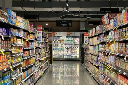 grocery store aisle with stocked shelves