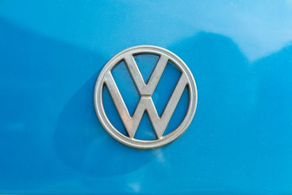 a close up of a volkswagen emblem on a blue car
